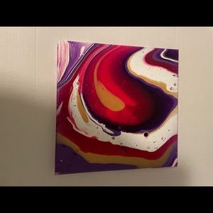 Vibrant acrylic pour painting, gold, white, purple and pink fluid art.